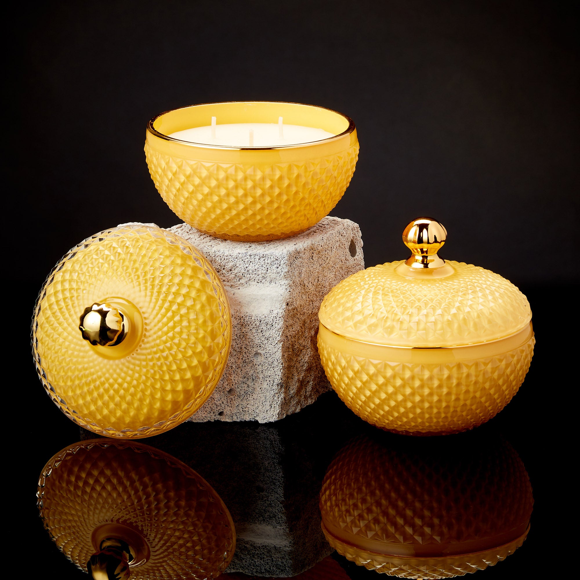 scented candle in round shaped candle glass in sherbet yellow